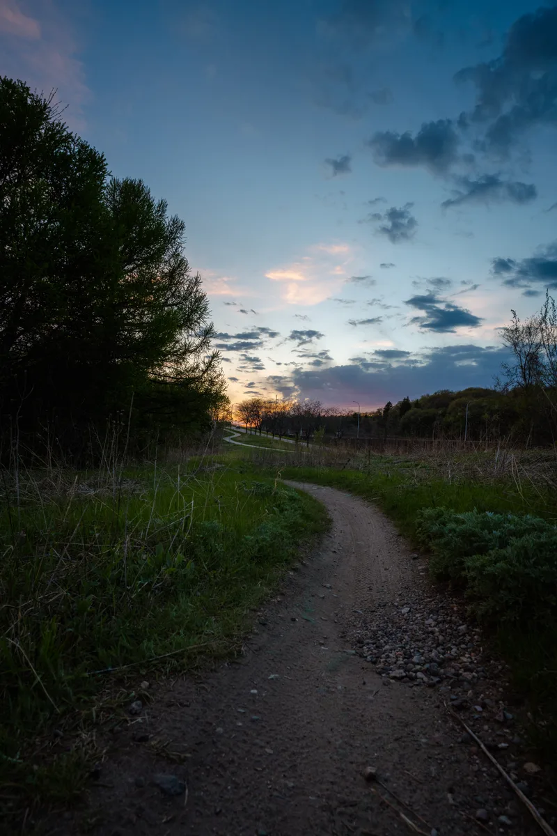 late sunset on a mountain bike trail in the city