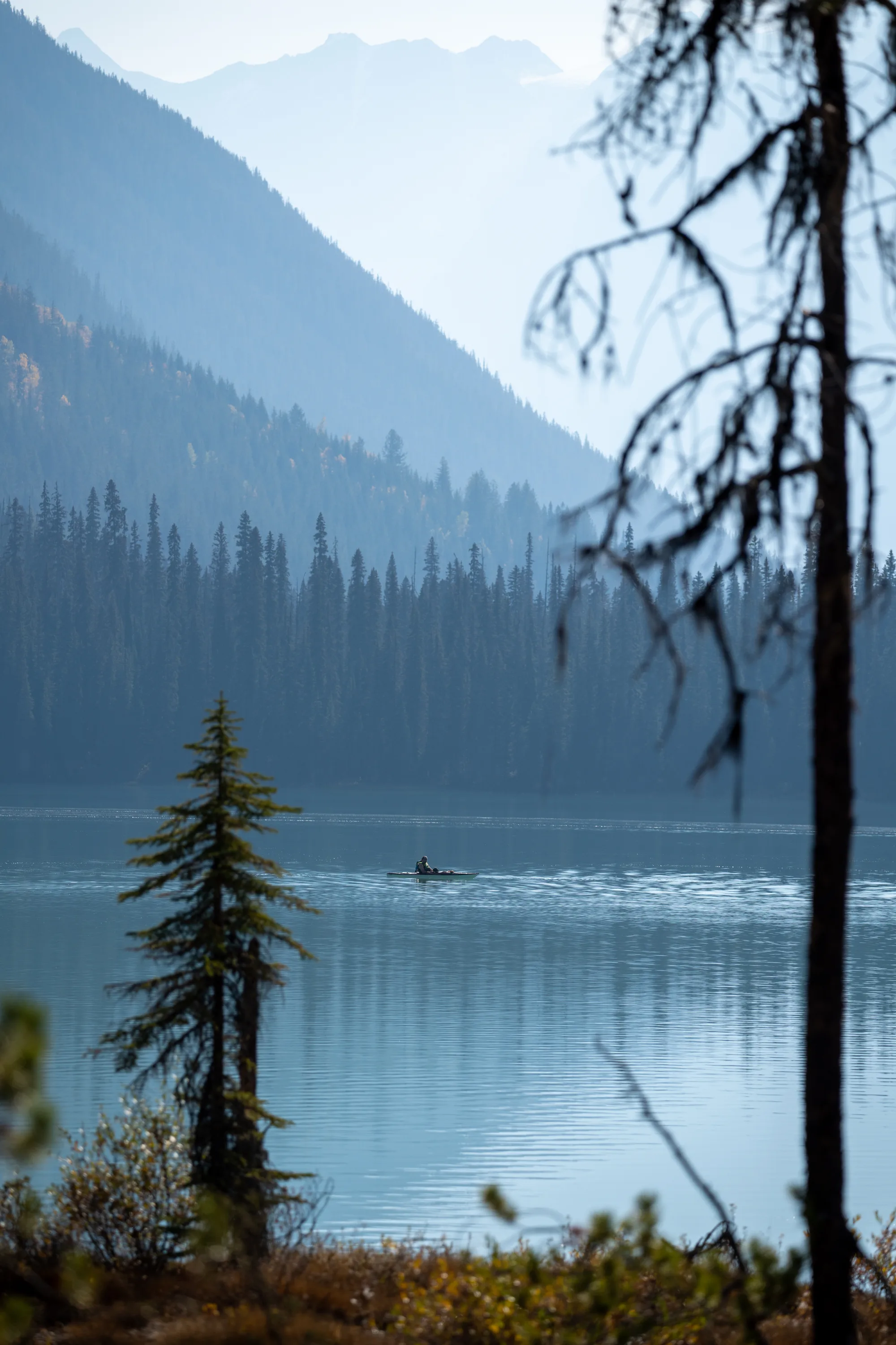 lone kayak out on emerald lake