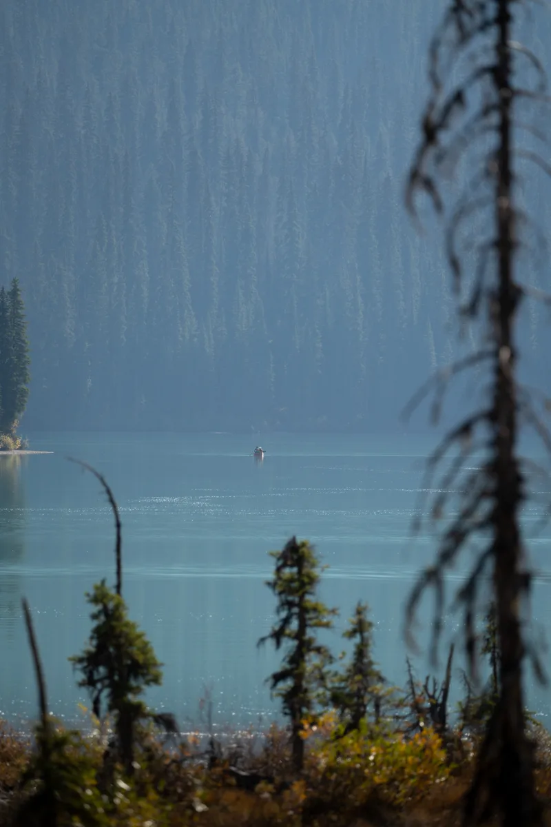lone canoe out on emerald lake