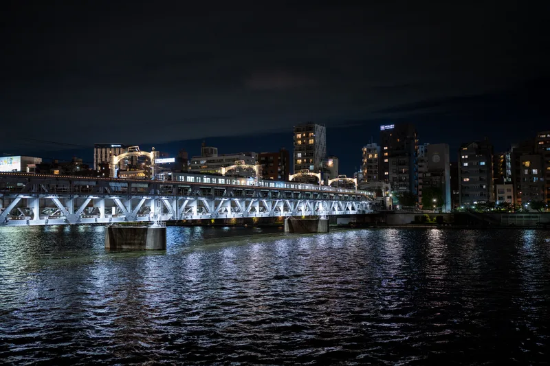 train bridge over the sumida river in tokyo japan at night