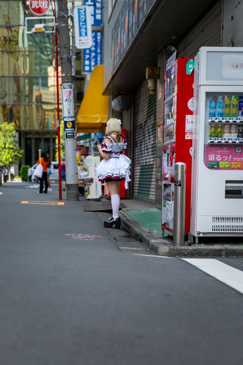 maid cafe worker facing away from the camera in central akihabara