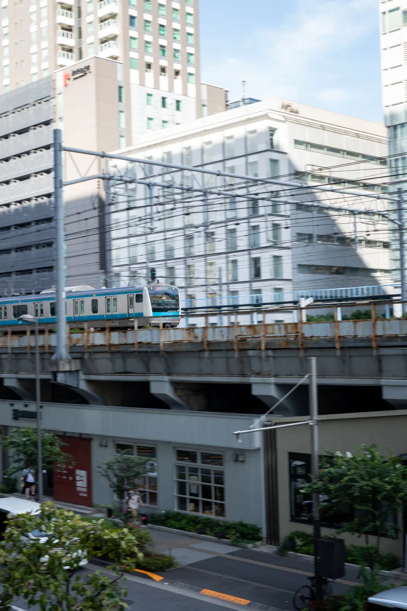 train coming into the station with a blured motion on the surrounding environment