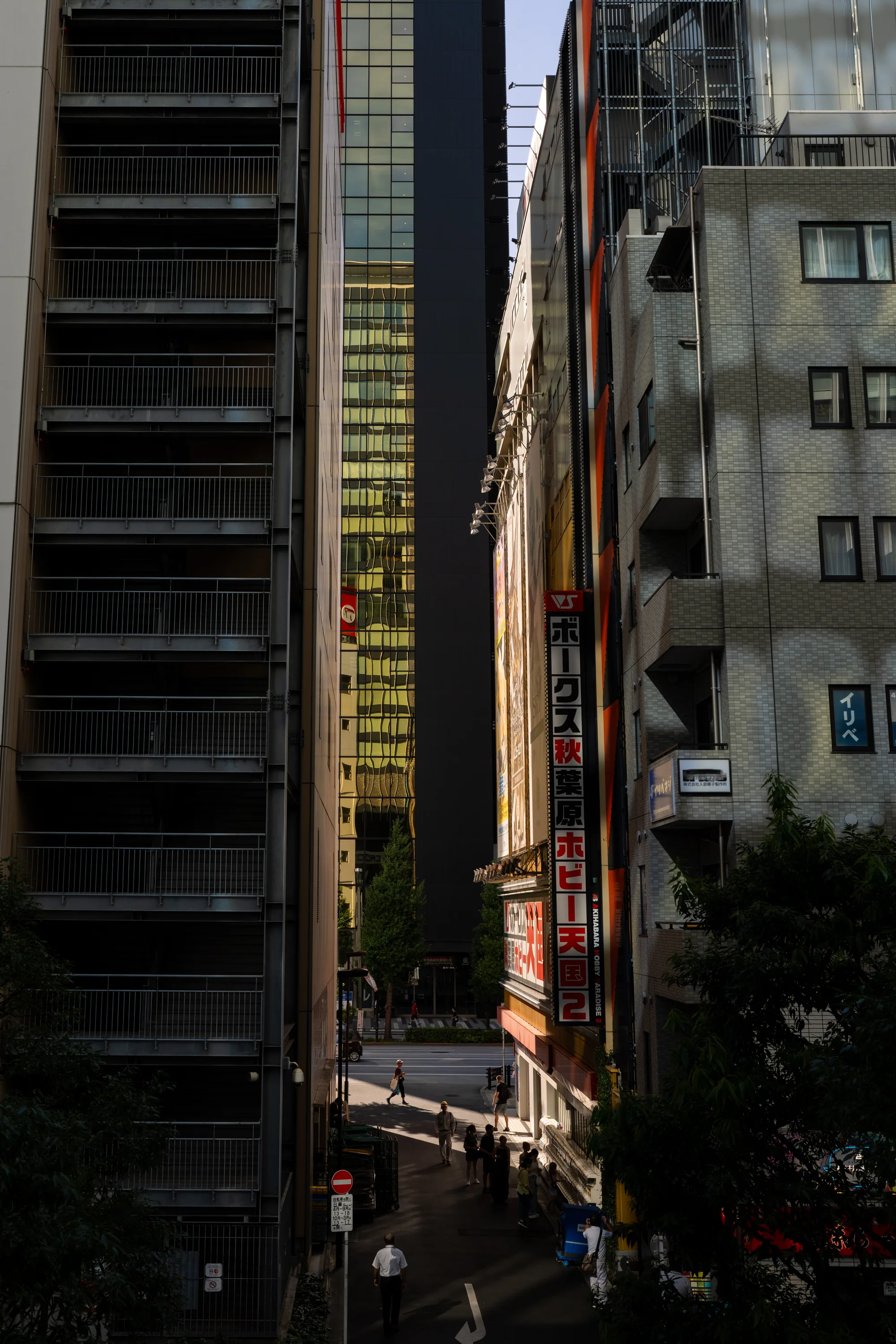 sun lighting an alley at sunset in akihabara tokyo japan